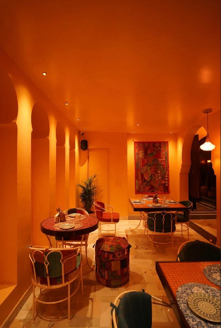 Nuroh Cafe interior with warm amber-lit Moorish arches